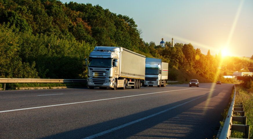 arriving-white-truck-road-rural-landscape-sunset