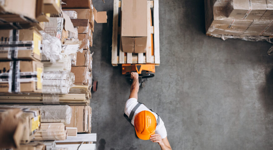 young-man-working-warehouse-with-boxes